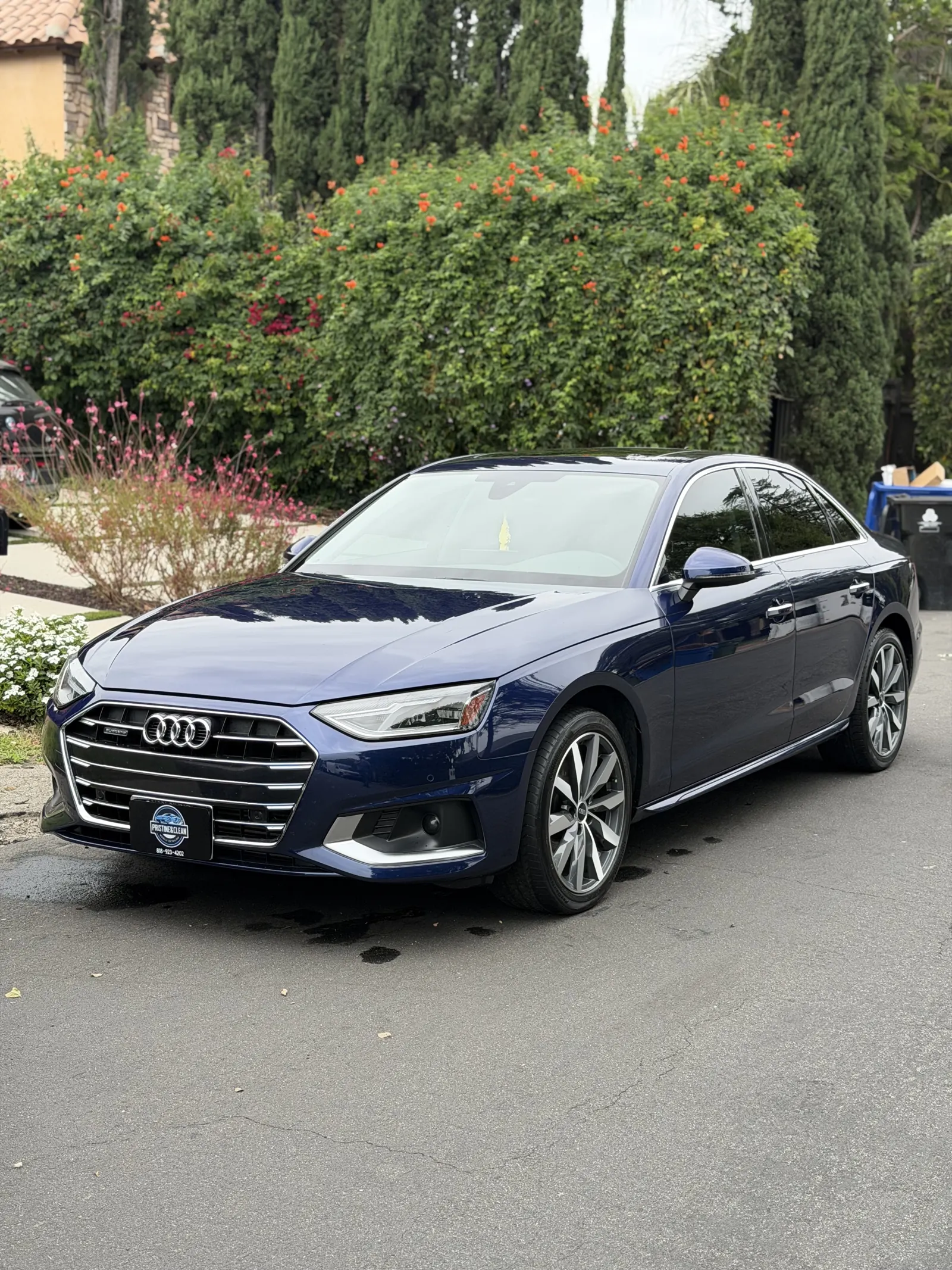 Navy Audi A4 in a driveway after a Full Detail